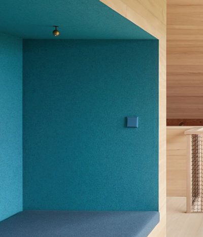 JUNG LS990 light switch in cerulean blue on blue wall