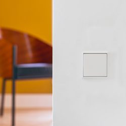 Jung LS990 white light switch on wall