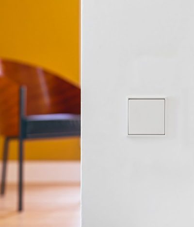 Jung LS990 white light switch on wall