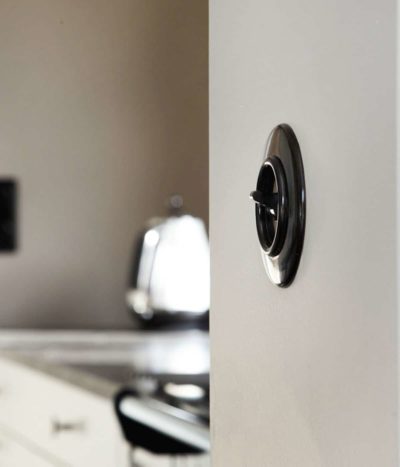 THPG Bakelite toggle light switch on kitchen wall